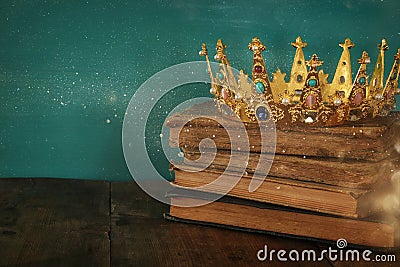 queen/king crown on old book. vintage filtered. fantasy medieval period Stock Photo