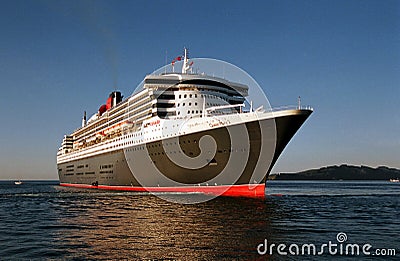 RMS Queen Mary 2 at sea at sunrise Editorial Stock Photo