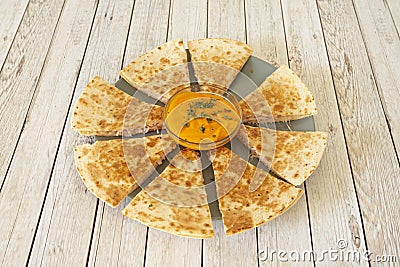 The quesadilla is a Mexican dish of corn or wheat tortilla, folded in half that Stock Photo