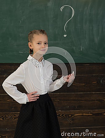 Question and answer. girl wrote question mark on board. she know the answer. question and answer concept. little girl Stock Photo