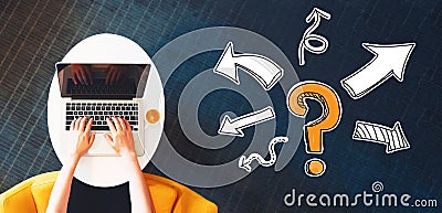 Question mark with arrows with person using a laptop Stock Photo