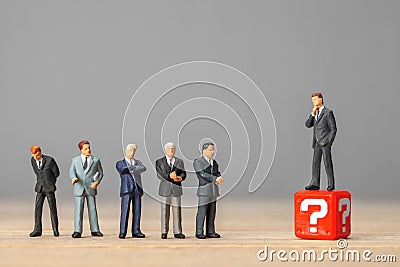 Question mark and businessman in a suit. Concept employee selection, dismissal or reduction, problem solving, market Stock Photo
