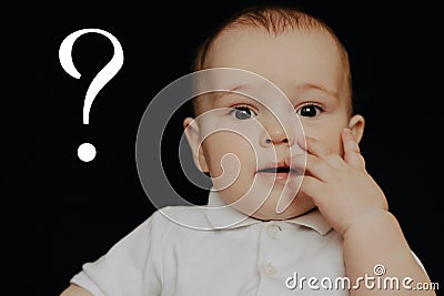 Question mark concept. Surprised questioning little boy Stock Photo