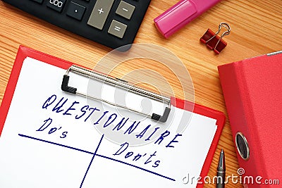 QUESTIONNAIRE Do`s and Don`ts sign on the piece of paper Stock Photo