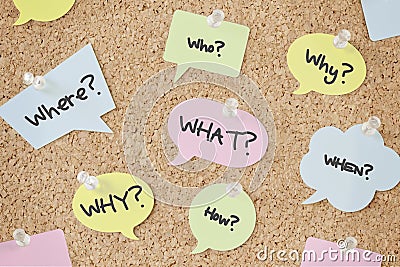 Questions speech bubbles on pinboard Stock Photo