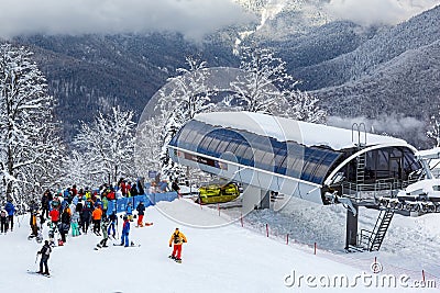 The queue for boarding the ski lift at the Rosa Khutor resort on a sunny day Editorial Stock Photo