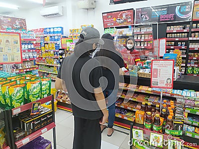 Queue in minimarket casier Editorial Stock Photo