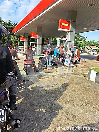 queues for refueling vehicles at Pertamina Indonesia due to the scarcity of fuel supply and high prices pertamax, pertalite Editorial Stock Photo