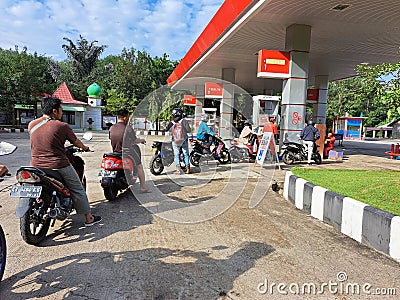 queues for refueling vehicles at Pertamina Indonesia due to the scarcity of fuel supply and high prices pertamax, pertalite Editorial Stock Photo