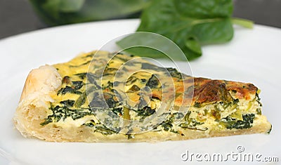 Quiche or pie with spinach Stock Photo