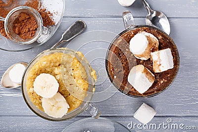 Quick banana and chocolate mug cakes Stock Photo