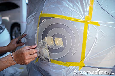 Quick car paint repair ,It takes one to two hours Stock Photo