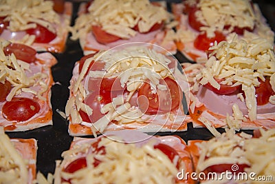 Quick mini pizzas ready for baking. Stock Photo