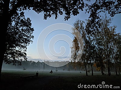 Quiet autumn dawn in the city park Stock Photo