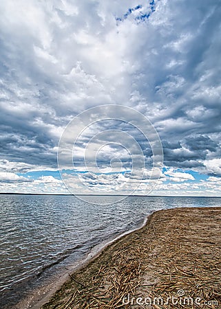 Quiet beach cloudy sky little wind Stock Photo