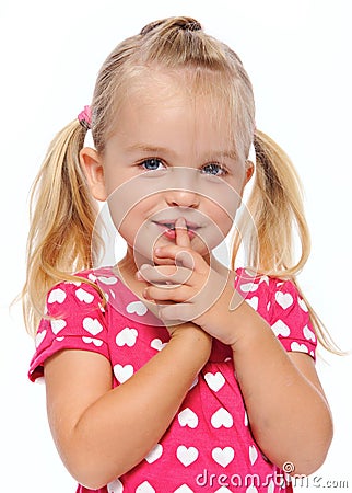 Quiet girl with finger on lips Stock Photo