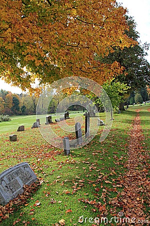 Quiet path through the graveyard Stock Photo
