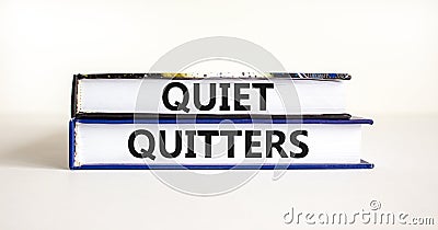 Quiet quitters symbol. Concept words Quiet quitters on books. Beautiful white table white background. Business and quiet quitters Stock Photo