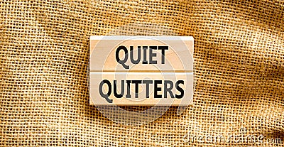 Quiet quitters symbol. Concept words Quiet quitters on wooden blocks. Beautiful canvas table canvas background. Business and quiet Stock Photo