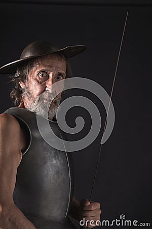 Quijote. Old bearded warrior with breastplate and helmet Stock Photo