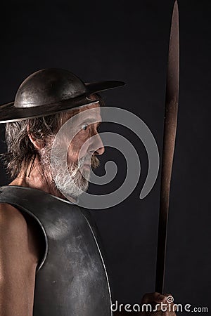 Quijote. Old bearded warrior with breastplate and helmet Stock Photo