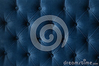 Quilted velour buttoned classic blue color fabric wall pattern background. Elegant vintage luxury sofa upholstery. Interior plush Stock Photo