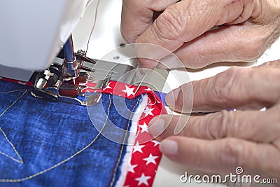 Quilter working on mitered corner. Stock Photo