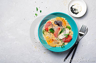 Quinoa with Chicken Fillet, Orange, Grapefruit and Fresh Salad Leaves Stock Photo