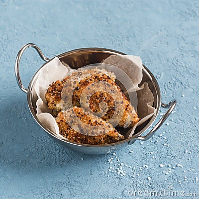 Quinoa crusted chicken in a metal bowl. Stock Photo