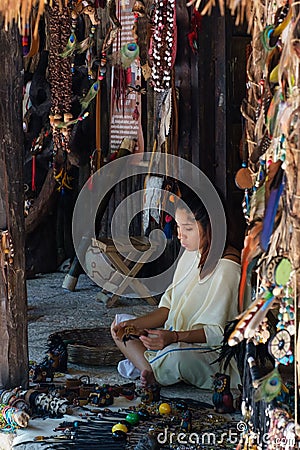Young girl making handicrafts at a local mayan community Editorial Stock Photo