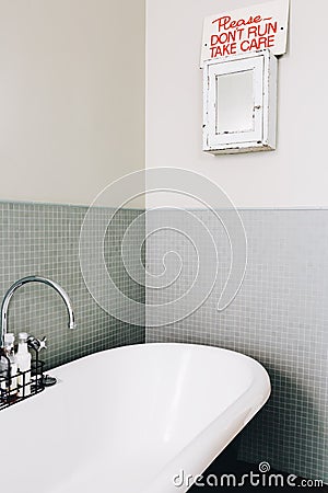 Quirky don`t run sign in a vintage styled bathroom Stock Photo