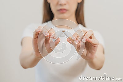 Quit, stop smoking, addiction asian young woman, girl refusing cigarette, smoker quitting smoke, hand in broken, break tobacco. Stock Photo