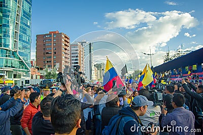 Quito, Ecuador - April 7, 2016: Closeup opposition leader Andres Paez surrounded by people, police and journalists Editorial Stock Photo