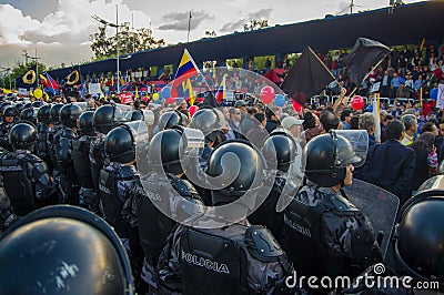 Quito, Ecuador - April 7, 2016: Police awaiting overlooking peaceful anti government protests in Shyris Avenue Editorial Stock Photo