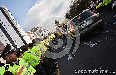 Quito, Ecuador - April 7, 2016: Police awaiting overlooking peaceful anti government protests in Shyris Avenue Editorial Stock Photo