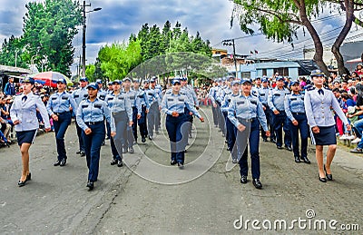 Quito, Ecuador - January 31, 2018: Outdoor view of unidentified group of women wearing a police uniform and walking in Editorial Stock Photo