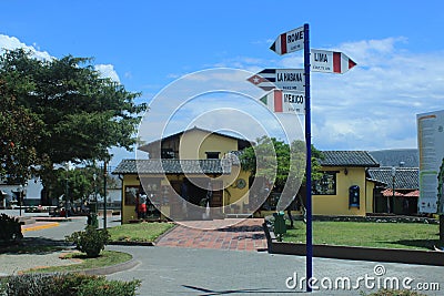 Quito, Ecuador 24-11-2019: The many Signs to world`s largest city with distance in mitad del mundo, quito Editorial Stock Photo