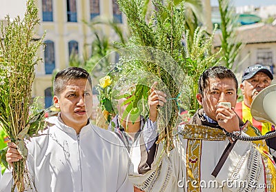 QUITO, ECUADOR- MARCH 23, 2018: Outdoor view of unidentified people and priest holding in hands a megaphone and Editorial Stock Photo
