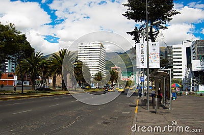 QUITO, ECUADOR - MAY 06 2016: Unidentified people waling in the mainstreet in NNUU avenue with some buildings, cars and Editorial Stock Photo