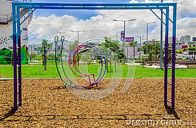 QUITO, ECUADOR- NOVEMBER, 27, 2017: Close up of beautiful outdoor view of metallic public children games estructures in Editorial Stock Photo