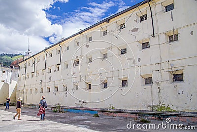 QUITO, ECUADOR - NOVEMBER 23, 2016: Unidentified people taking pictures at indoor in backyard in the old prison Penal Editorial Stock Photo