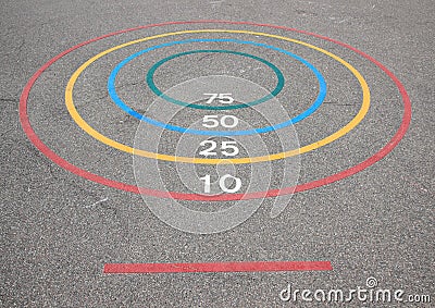 Quoits game with winning circles and baseline on asphalt Stock Photo