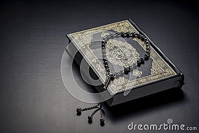 Quran Holy Book and Beads Stock Photo