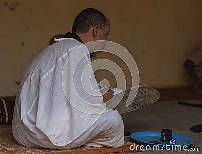 Quran teacher at work Editorial Stock Photo
