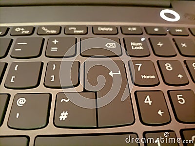 Qwerty keyboard for office use, keypad of a laptop, Enter button, alphabet and symbols on a keyboard Stock Photo