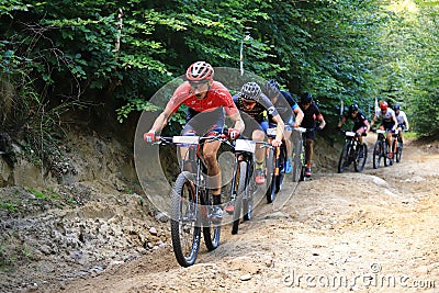 Competitors racing along the forest roads of the Tricity Landscape Park Editorial Stock Photo
