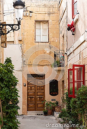 Rabat,: Decorated narrow alley with flowers and open windows Editorial Stock Photo