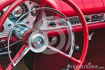 Rabat / Malta - July 24 2019: Close up of red steering wheel inside the cockpit of a Ford Thunderbird sports car Editorial Stock Photo