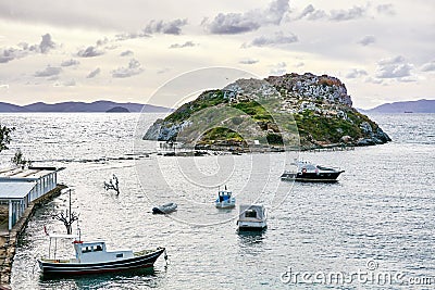 Rabbit island, fishing boats and Aegean sea in Bodrum, Gumusluk, Mugla, Turkey Stock Photo