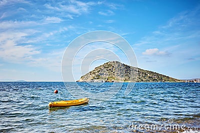 Rabbit island and a yellow canoe on the sea in Bodrum Gumusluk T Stock Photo